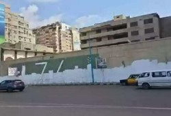 الإسكندرية تطمس أكبر جرافيتي لتأبين شهداء بورسعيد