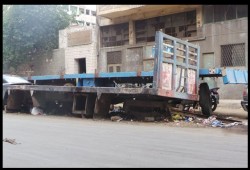 أهالى القباري بالإسكندرية يعانون من مخلفات ورش النقل الثقيل