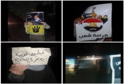 فعالية ليلية لثوار قطور ترفع لافتات "25 يناير كرامة شعب"