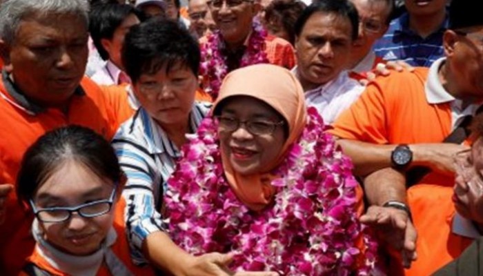 فوز مسلمة متزوجة من عربي برئاسة سنغافورة.. ما جنسيته؟