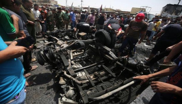 140 قتيلاً وجريحاً بتفجير سيارة مفخخة وهجوم جنوب بغداد