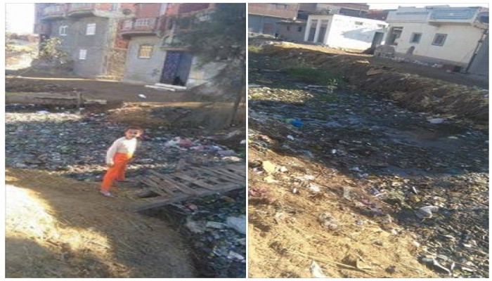 انسداد مصرف قرية الصالحية بأبو حمص بالقمامة والحيوانات النافقة