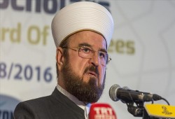 القرة داغي لماكرون: الإسلام لا يتحمل وزر قيادات كرتونية من صنعكم