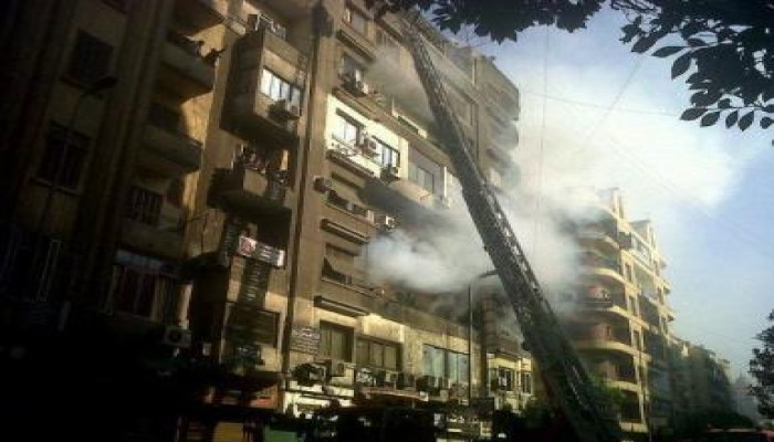 حريق فى أحد شقق عمارة سكنية بشارع التحرير قبالة وزارة الداخلية