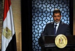 ياسر علي: الرئيس مرسي بحث مع نجاد وقف نزيف الدم في سوريا