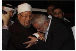صورة وتعليق القرضاوي وهنية