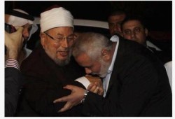 صورة وتعليق القرضاوي وهنية