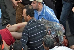 اللجان الشعبية في جامعة القاهرة تضبط ضابط أمن دولة يطلق النيران علي مؤيدي الرئيس