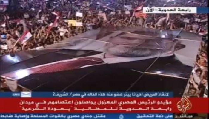 المرابطون بـ"رابعة العدوية" يرفعون أكبر صورة لرئيس دولة في العالم للرئيس مرسي