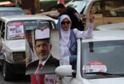 التايم :  مرسي  سجين راي وابقائه قيد الاختطاف حتى تبحث النيابة عن تهمة له