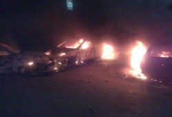 الشرطة تحرق سيارات المعتصمين بميدان النهضة الان (مصور)