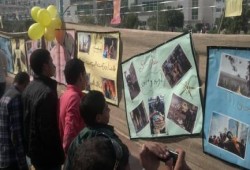طلاب جامعة بني سويف ينظمون معرض صور لشهداء مجازر العسكر