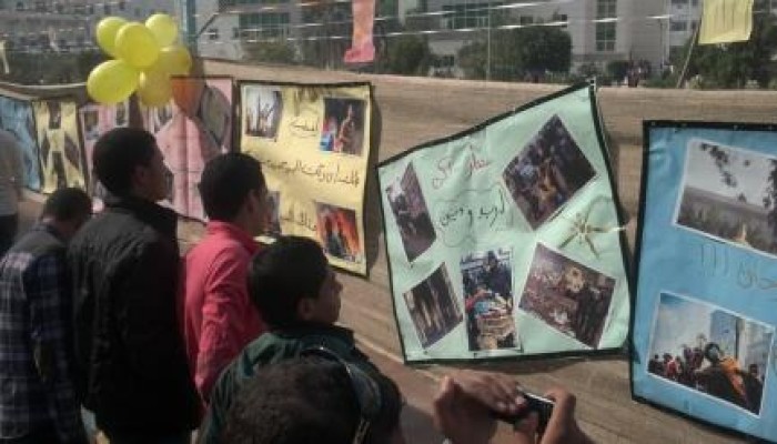 طلاب جامعة بني سويف ينظمون معرض صور لشهداء مجازر العسكر
