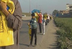 البحيرة: سلسلة بشرية لمؤيدي الشرعية بدمنهور على طريق "القاهرة-إسكندرية " الزراعي (صور)