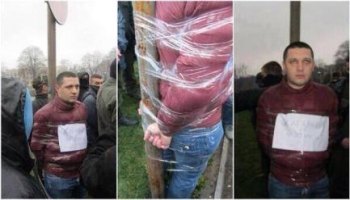 بعد نجاح ثورتهم: ثوار اوكرانيا يقيدون مدير أحد الجمارك لتورطه في الفساد