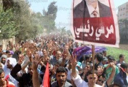 "معا للخلاص" كلاب الشرطة يطلقون الغاز والخرطوش علي المتظاهرين بأسيوط