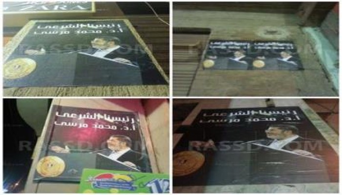 أهالي كرداسه يزينون شوارع المدينة بصور الرئيس مرسي