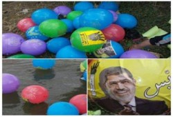 بالصور.. الأهالي يلقون ببالونات رابعة في مياة النيل بمركز "منية النصر"