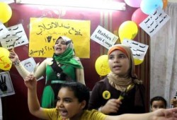 بالصور: حركة رضع ضد الانقلاب ببورسعيد تندد بالانقلاب العسكري في سبوع مولودة جديدة