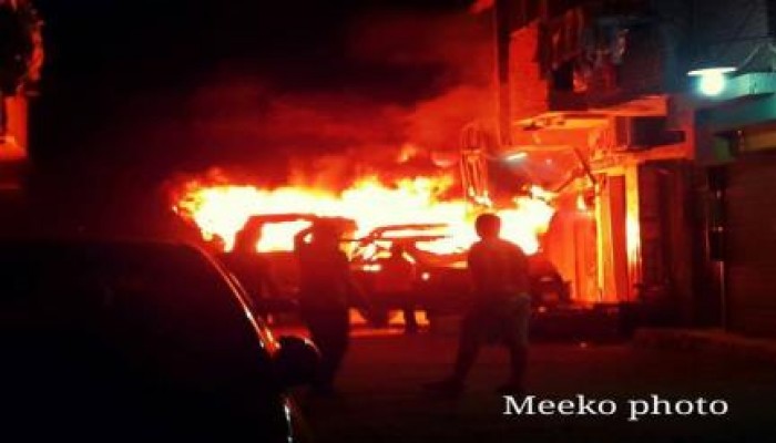 بالصور : مجهولون يحرقون عربة شرطة بشارع فيصل بـ الجيزة