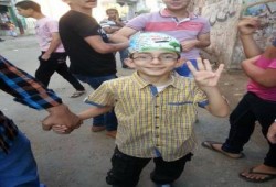 لافتات وكابات العيد بأسماء المعتقلين والشهداء في دمياط