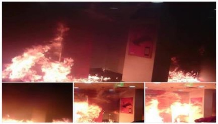 بالصور: مجهولون يضرمون النيران بفرع شركة موبينيل بحلوان.. ومراقبون السبب "فالكون"