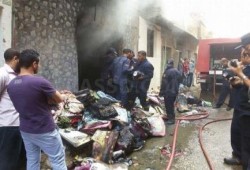 بالصور .. حريق في أحد شوارع ‫‏الأقصر‬ للمرة الثانية خلال 24 ساعة يلتهم محل للملابس