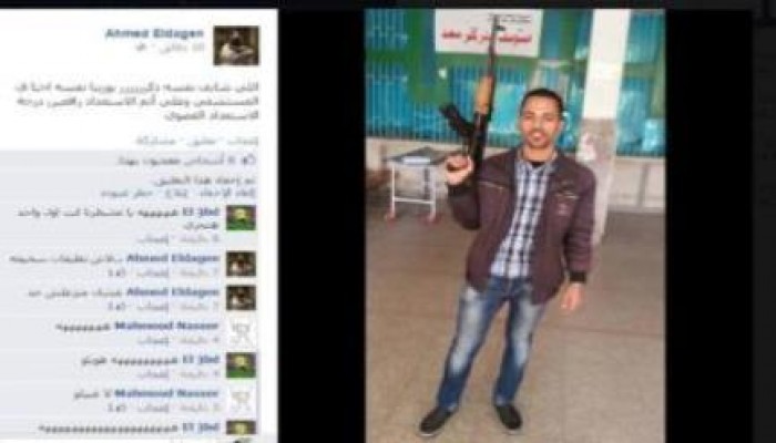 بلطجي ينشر صورة على الفيس بسلاح آلي ميري يتوعد به المتظاهرين