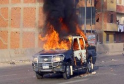 جمعة الإصرار والتحدي  : مجهولون يحرقون سيارتي ضابطي شرطة في بني سويف