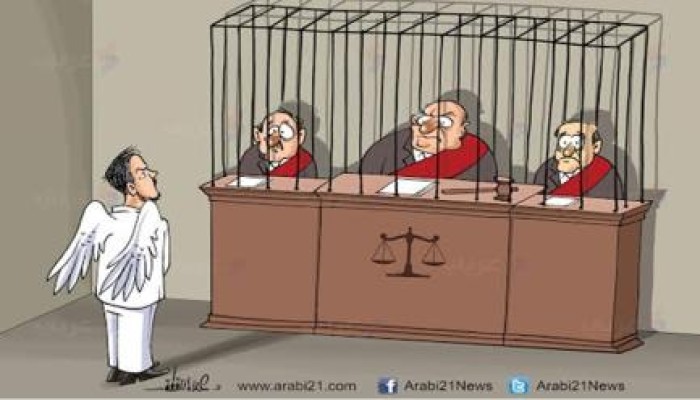 كاريكاتير: مرسي حر رغم قيدهم