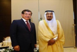 العاهل السعودي يلتقي داود أوغلو على هامش "قمة العشرين"